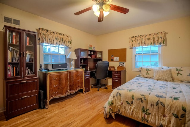 bedroom featuring ceiling fan and light hardwood / wood-style flooring