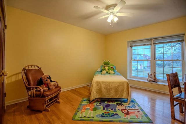 bedroom featuring ceiling fan and hardwood / wood-style flooring