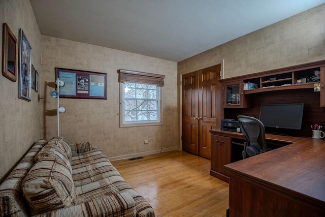 office area with light hardwood / wood-style flooring