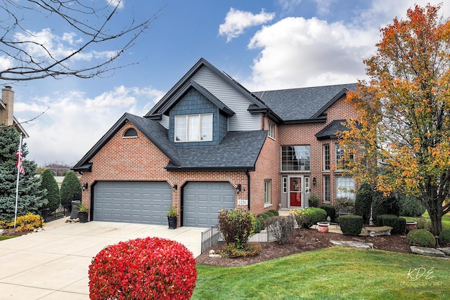 view of front property featuring a garage and a front lawn