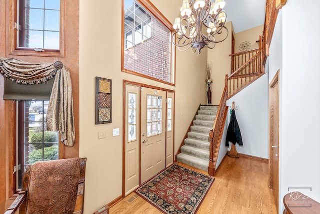 foyer featuring light wood-type flooring and a healthy amount of sunlight