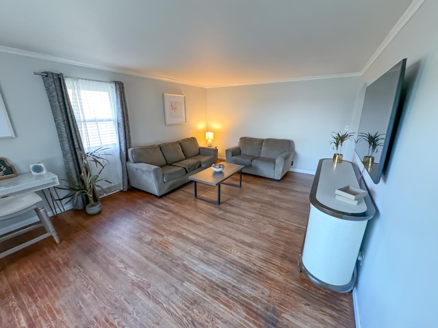 living room with hardwood / wood-style flooring and crown molding