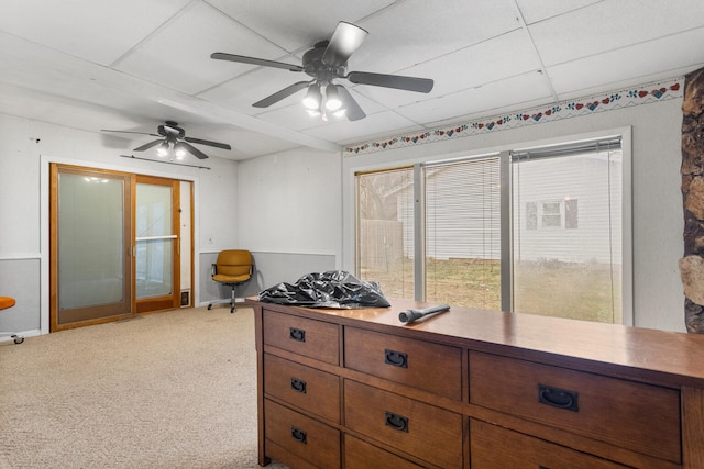 kitchen featuring ceiling fan and light carpet