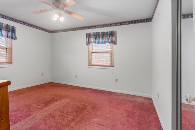 empty room featuring carpet floors, a wealth of natural light, and ceiling fan