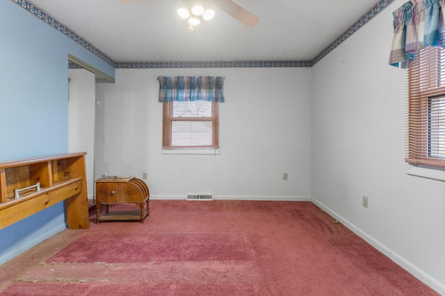 sitting room with ceiling fan, a healthy amount of sunlight, and carpet floors