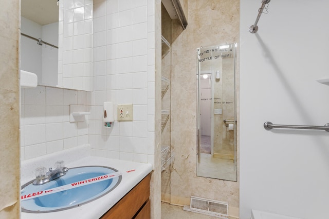 bathroom with tile patterned flooring and vanity