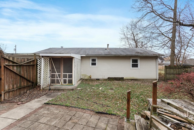 back of house with a sunroom