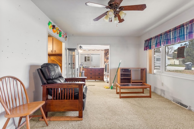 bedroom featuring ceiling fan and carpet