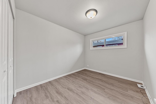 unfurnished room featuring light wood-type flooring