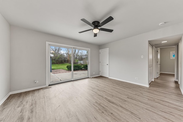 spare room featuring ceiling fan and light hardwood / wood-style flooring