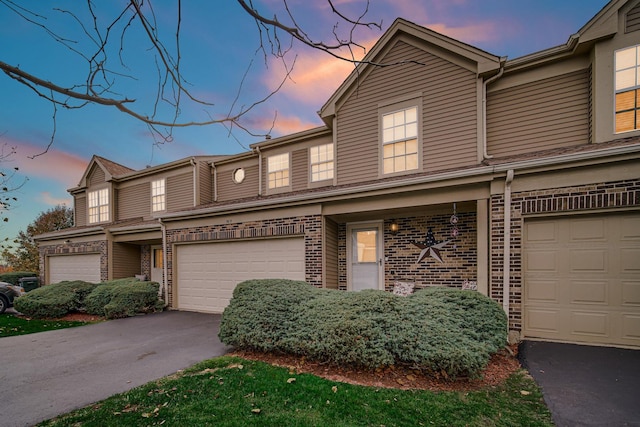 multi unit property featuring a garage