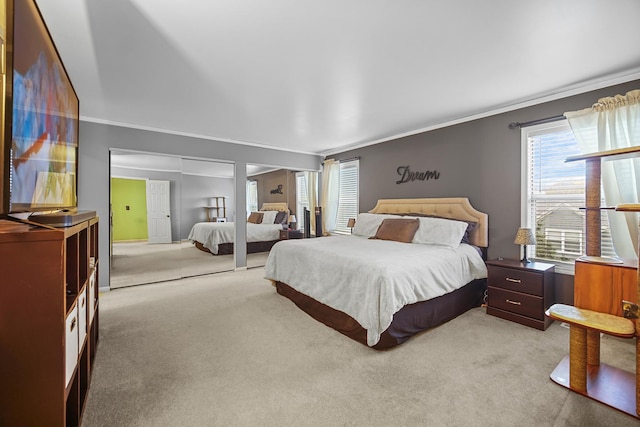 carpeted bedroom with ornamental molding