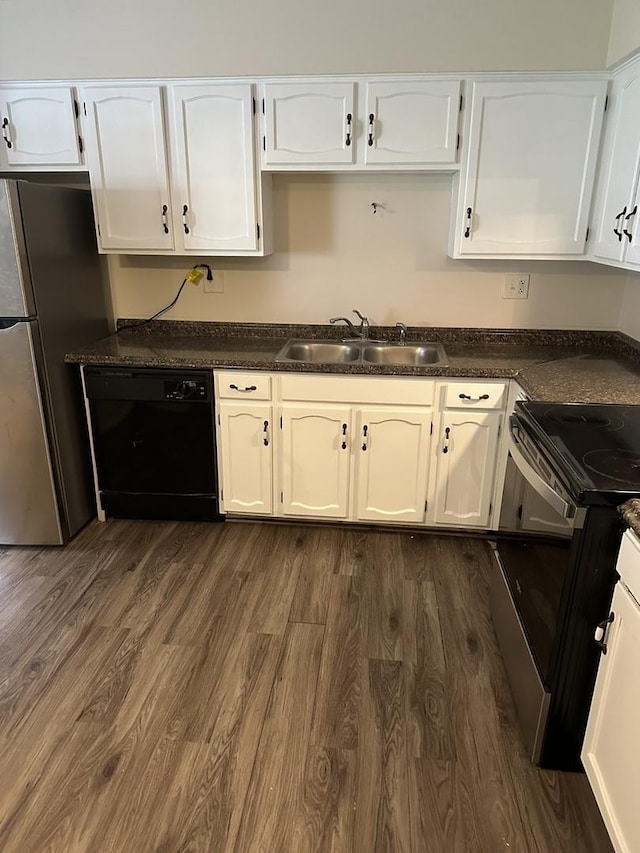 kitchen featuring dark hardwood / wood-style flooring, sink, white cabinets, and black appliances