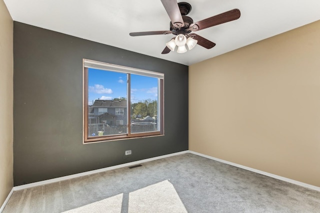 carpeted empty room with ceiling fan