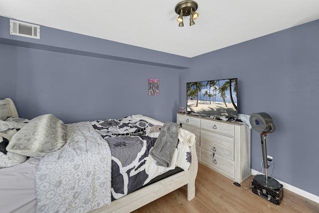 bedroom featuring light hardwood / wood-style floors