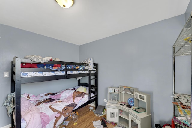 bedroom with hardwood / wood-style flooring