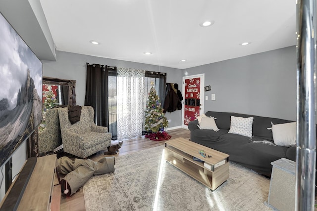 living room with light hardwood / wood-style flooring