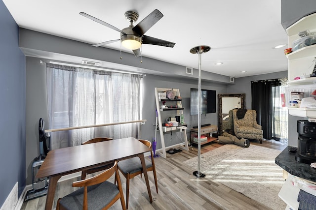 dining area featuring light hardwood / wood-style flooring and ceiling fan