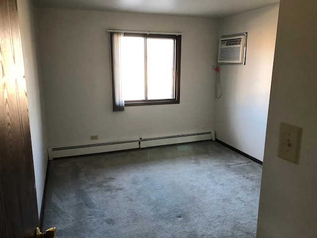 carpeted empty room featuring a wall mounted AC and a baseboard heating unit