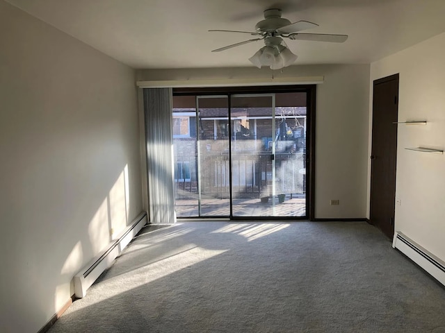 carpeted empty room with ceiling fan and a baseboard heating unit