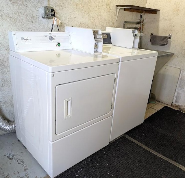 washroom with washer and dryer