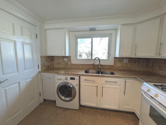 kitchen featuring white appliances, white cabinets, sink, ornamental molding, and washer / clothes dryer