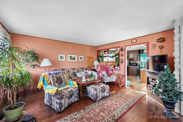 living room featuring dark wood-type flooring