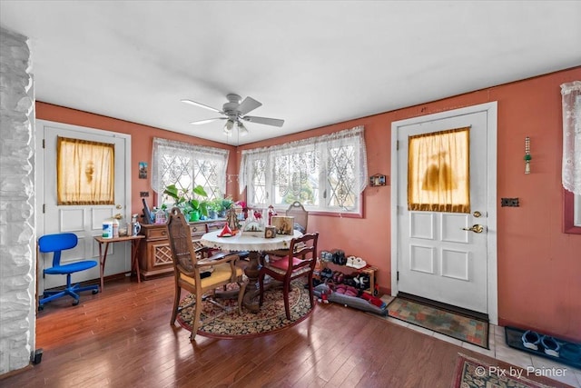 dining space featuring hardwood / wood-style floors and ceiling fan