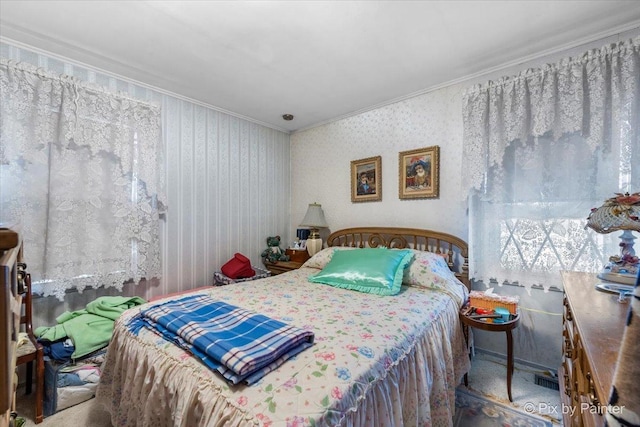 bedroom with carpet floors and ornamental molding