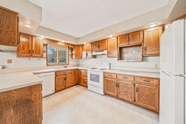 kitchen with white appliances and sink