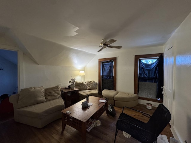 living room with ceiling fan, hardwood / wood-style floors, and vaulted ceiling