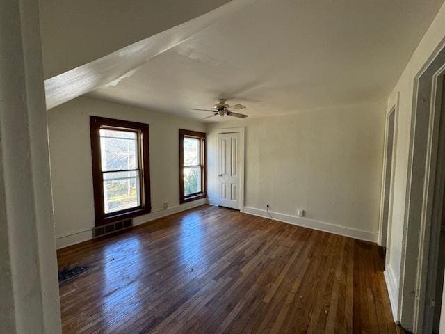 interior space featuring ceiling fan and dark wood-type flooring