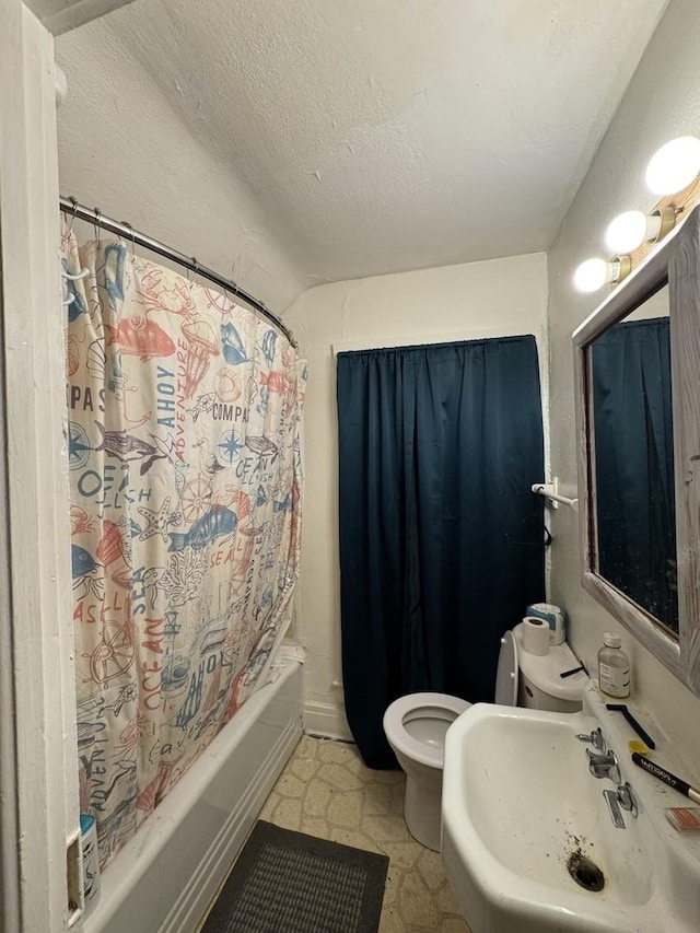 full bathroom with a textured ceiling, toilet, shower / bathtub combination with curtain, and sink