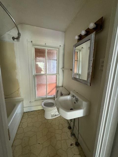 full bathroom featuring sink, tile patterned flooring, bathtub / shower combination, and toilet