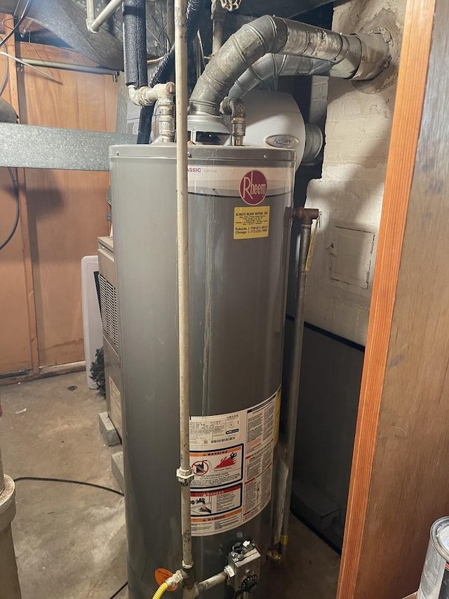 utility room featuring gas water heater