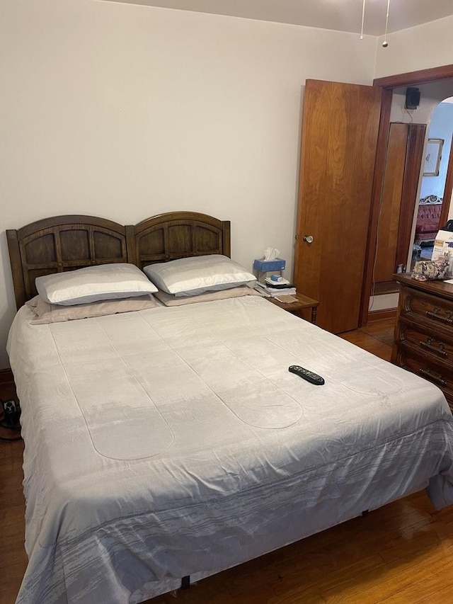 bedroom featuring wood-type flooring