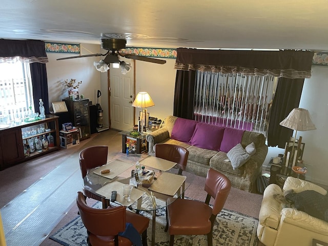 carpeted living room featuring ceiling fan