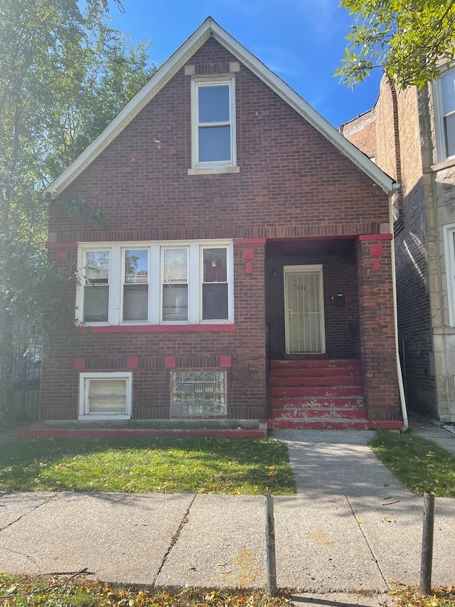 7042 S Vernon Ave, Chicago, IL 60637 - view of front of home with brick siding and a front lawn