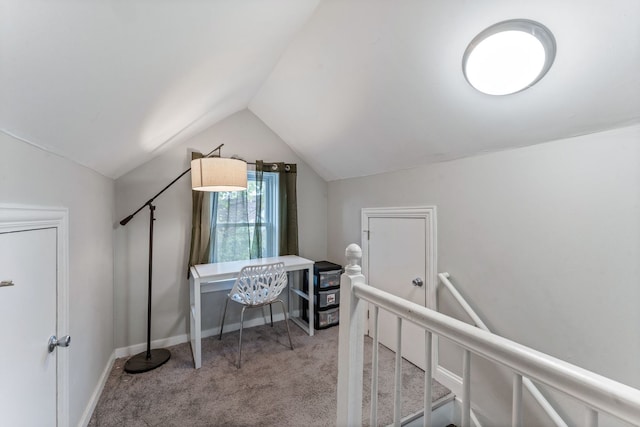 office featuring lofted ceiling and light carpet