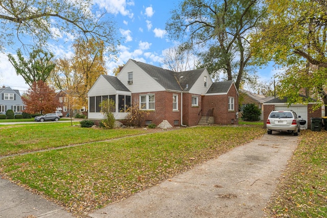 view of front facade with a front yard and a sunroom