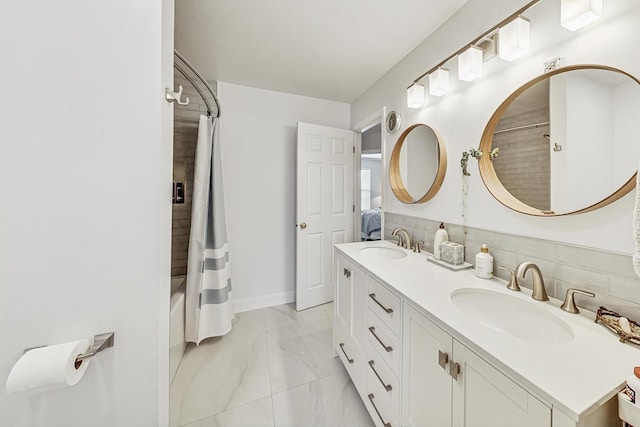 bathroom featuring vanity, shower / bath combo, and tasteful backsplash