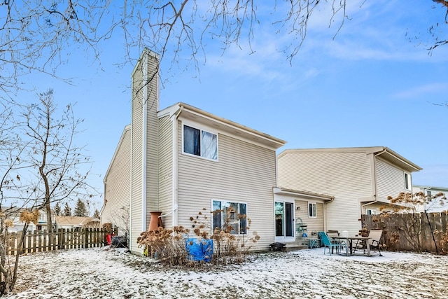 view of snow covered house