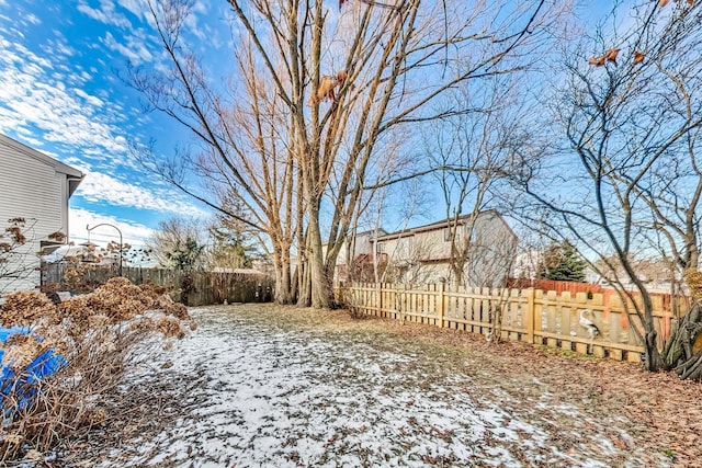 view of yard layered in snow