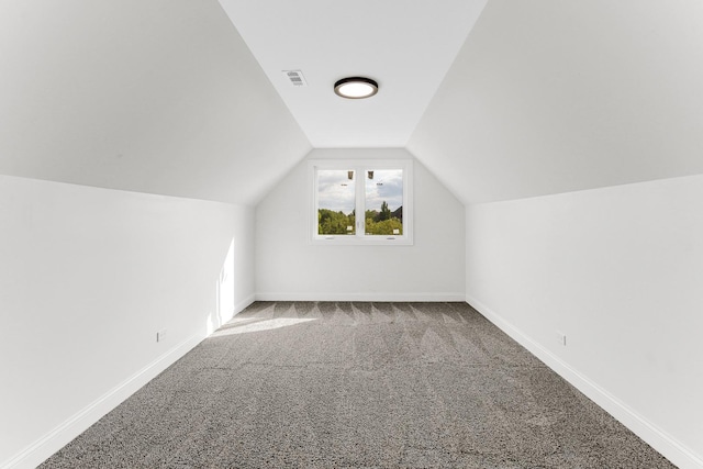 bonus room featuring carpet flooring and vaulted ceiling