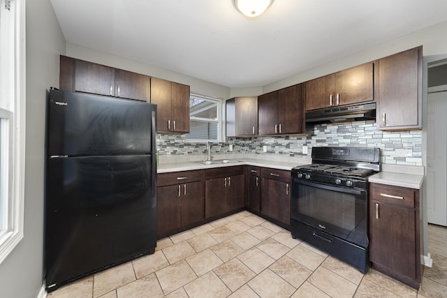 kitchen with black appliances, decorative backsplash, dark brown cabinetry, and sink