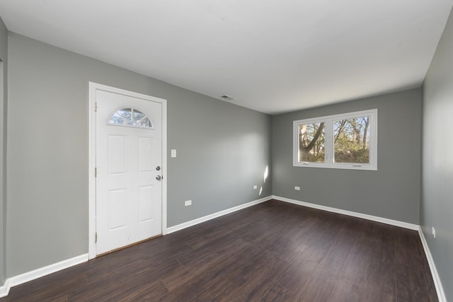 entrance foyer featuring dark hardwood / wood-style floors