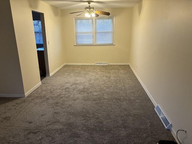 empty room featuring carpet and ceiling fan