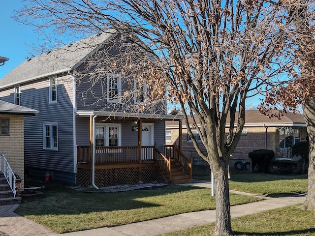 view of front of property with a front lawn and a wooden deck