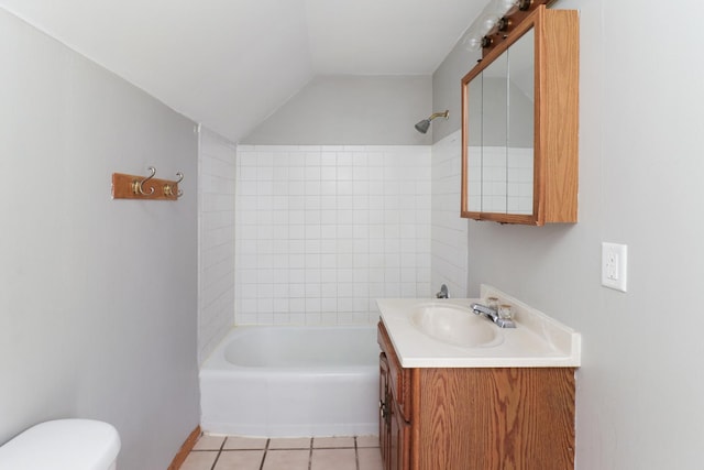 full bathroom featuring tile patterned flooring,  shower combination, lofted ceiling, toilet, and vanity