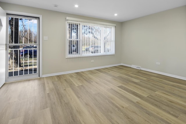 empty room with light wood-type flooring